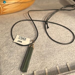 Jade pendant on black cord 1-1/2” pendant